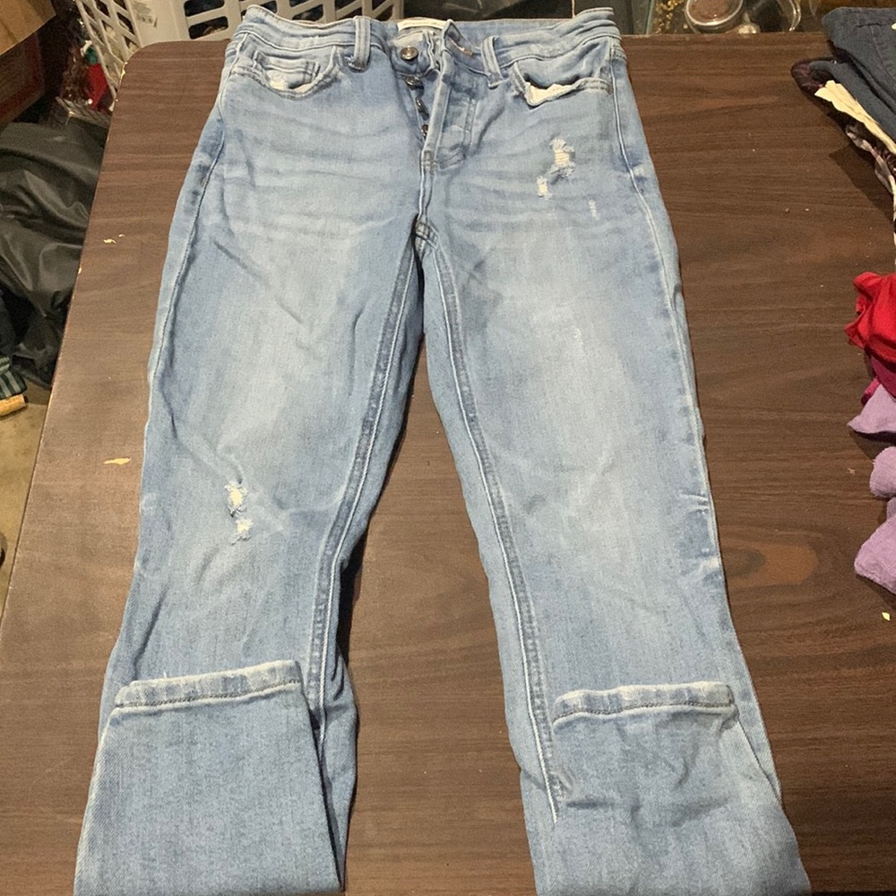 Studio Blue skinny jeans with subtle rips and button down instead of zipper